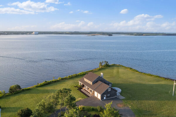 st andrews beach house drone shot view of main residence, brudenell river, and georgetown